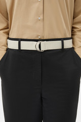 Profile view of model wearing the Oroton Quinn Webbing Belt in Antique White and 100% cotton material for Women .