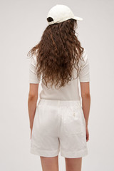 Profile view of model wearing the Oroton Alfie Carpenter Short in Antique White and Crafted from cotton twill  for Women . IP:5