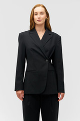 Profile view of model wearing the Oroton Wrap Blazer in Black and 98% wool,  2% elastane material for Women .