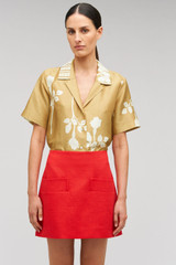 Profile view of model wearing the Oroton Embellished Rosebud Camp Shirt in Camel and 100% Silk Material for Women .