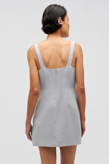 Profile view of model wearing the Oroton Mini Sequin Flower Shift Dress in Oyster and 100% linen for Women .