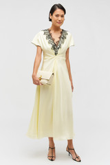 Profile view of model wearing the Oroton Fringe Lace Dress in Lemon Zest and 100% silk for Women .