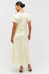 Profile view of model wearing the Oroton Fringe Lace Dress in Lemon Zest and 100% silk for Women .