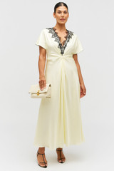 Profile view of model wearing the Oroton Fringe Lace Dress in Lemon Zest and 100% silk for Women .