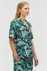 Profile view of model wearing the Oroton Garden Toile Embellished Camp Shirt in Ivy and 100% silk for Women .