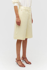 Profile view of model wearing the Oroton Culotte in Lemon Zest and 100% linen for Women .