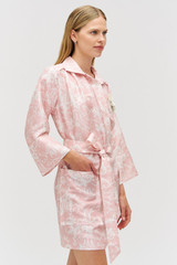 Profile view of model wearing the Oroton Garden Toile Embellished Tunic Dress in Peony and 100% silk for Women .
