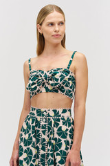 Profile view of model wearing the Oroton Fan Flower Tie Top in Ivy and 100% cotton for Women .