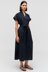 Profile view of model wearing the Oroton Rae Gathered Dress in North Sea and 100% cotton for Women .