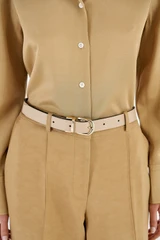 Profile view of model wearing the Oroton Inez Reversible Belt in Navy/Fawn and Premium smooth leather for Women .