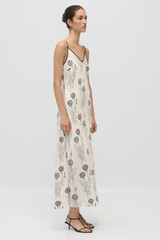 Profile view of model wearing the Oroton Graphic Dandelion Slip Dress in Ecru and 100% Silk Twill for Women .