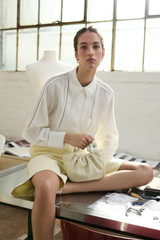 Profile view of model wearing the Oroton Lace Detail Long-Sleeve Shirt in White and 100% Linen for Women . IP:2