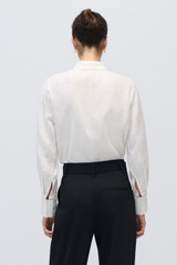 Profile view of model wearing the Oroton Lace Detail Long-Sleeve Shirt in White and 100% Linen for Women . IP:5