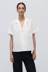 Profile view of model wearing the Oroton Lace Trim Blouse in White and 100% Cotton Poplin for Women .