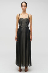 Profile view of model wearing the Oroton Sheer Bodice Dress in Black and 100% cotton material for Women .