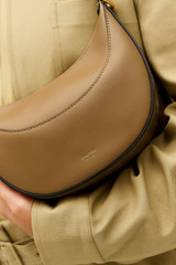 Profile view of model wearing the Oroton Florence Small Shoulder Bag in DARK TAUPE and Premium smooth leather for Women . IP:6