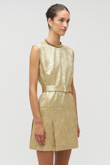 Profile view of model wearing the Oroton Gold Foil Dress in Gold and Premium metallic-blend fabric (57% polyester, 35% metal fibre, 8% polyamide) for Women . IP:5