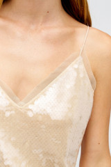 Profile view of model wearing the Oroton Sequin Slip Dress in Champagne and 100% polyester material for Women .