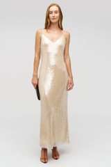 Profile view of model wearing the Oroton Sequin Slip Dress in Champagne and 100% polyester material for Women .