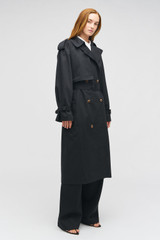 Profile view of model wearing the Oroton Essential Trench in WASHED BLACK and 65% polyester, 35% cotton blend for Women .