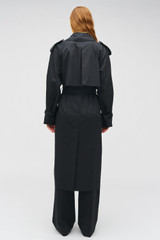 Profile view of model wearing the Oroton Essential Trench in WASHED BLACK and 65% polyester, 35% cotton blend for Women . IP:5