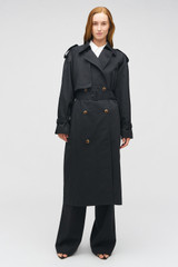 Profile view of model wearing the Oroton Essential Trench in WASHED BLACK and 65% polyester, 35% cotton blend for Women .