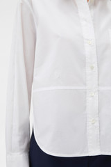 Profile view of model wearing the Oroton Crisp Poplin Shirt in White and 100% cotton fabric for Women .