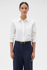 Profile view of model wearing the Oroton Crisp Poplin Shirt in White and 100% cotton fabric for Women .