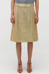 Profile view of model wearing the Oroton Gold Foil Skirt in Gold and Premium metallic blend material (57% polyester, 35% metal fibre, 8% polyamide) for Women .
