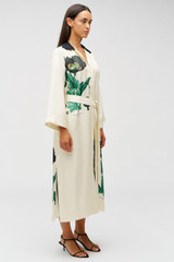 Profile view of model wearing the Oroton Graphic Poppy Column Dress in Cream and 100% silk fabric for Women .