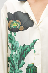 Profile view of model wearing the Oroton Graphic Poppy Ls Camp Shirt in Cream and 100% silk fabric for Women .