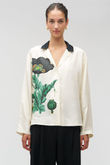 Profile view of model wearing the Oroton Graphic Poppy Ls Camp Shirt in Cream and 100% silk fabric for Women .