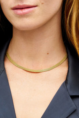Profile view of model wearing the Oroton Mathilde Necklace in Worn Gold and Premium brass material for Women .