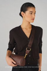 Profile view of model wearing the Oroton Harvey Baguette Crossbody in Chestnut and Premium smooth leather for Women .