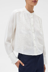 Profile view of model wearing the Oroton Doilie Detail Top in Antique White and 100% linen fabric for Women .