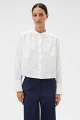 Profile view of model wearing the Oroton Doilie Detail Top in Antique White and 100% linen fabric for Women .