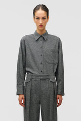 Profile view of model wearing the Oroton Tweed Overshirt in CHARCOAL TWEED and Premium blend of 29% polyester, 24% wool, 18% acrylic, 15% silk, 13% viscose, and 1% elastane for Women .