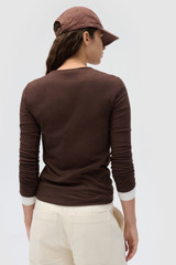 Profile view of model wearing the Oroton Eve Fine Rib Tee in Dark Chocolate and 85% cotton and 15% spandex blend fabric for Women .