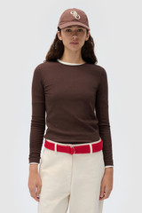 Profile view of model wearing the Oroton Eve Fine Rib Tee in Dark Chocolate and 85% cotton and 15% spandex blend fabric for Women .