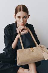Profile view of model wearing the Oroton Wren Poplin Shirt in North Sea and 100% cotton fabric for Women .