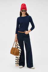Profile view of model wearing the Oroton Folk Straight Leg Pant in North Sea and 96% cotton and 4% spandex blend fabric for Women .