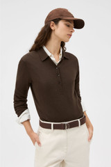 Profile view of model wearing the Oroton Flora Fine Knit Polo in Bitter Chocolate and 55% extra fine merino wool and 45% cotton blend fabric for Women .