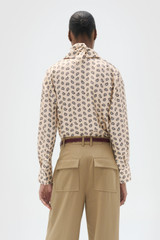 Profile view of model wearing the Oroton Foulard Print Blouse in Winter Peach and 100% silk twill fabric for Women .