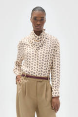 Profile view of model wearing the Oroton Foulard Print Blouse in Winter Peach and 100% silk twill fabric for Women .