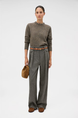 Profile view of model wearing the Oroton Nep Jewelled Crew Neck in Dark Rye and 65% merino wool, 30% nylon, and 5% alpaca blend fabric for Women .