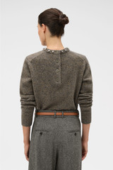 Profile view of model wearing the Oroton Nep Jewelled Crew Neck in Dark Rye and 65% merino wool, 30% nylon, and 5% alpaca blend fabric for Women .