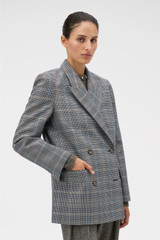 Profile view of model wearing the Oroton Check Man Style Blazer in Slate and 50% wool and 50% polyester blend fabric for Women .