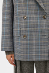 Profile view of model wearing the Oroton Check Man Style Blazer in Slate and 50% wool and 50% polyester blend fabric for Women .