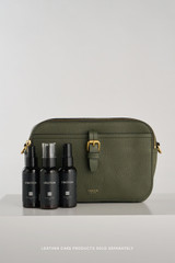 Profile view of model wearing the Oroton Dylan Camera Crossbody in CACTUS and Premium pebble leather for Women .