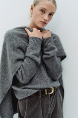 Profile view of model wearing the Oroton Cashmere Blend Knit in Grey Marle and 70% ultra-fine merino wool and 30% cashmere blend fabric for Women .